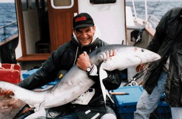 Harry hugs his Shark